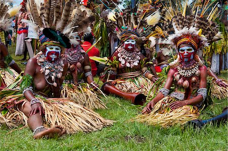 Colourfully dressed and face painted local tribes celebrating the traditional Sing Sing in the Highlands of Papua New Guinea, Pacific Stock Photo - Rights-Managed, Code: 841-06344104