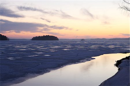 frozen surface - Sunset over the mainly frozen surface of Lake Pyhajarvi, the ice surrounds islands, at Tampere, Pirkanmaa, Finland, Scandinavia, Europe Stock Photo - Rights-Managed, Code: 841-06344200