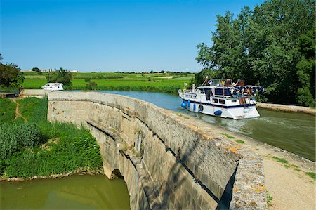 Navigation on the Canal du Midi, between Carcassone and Beziers, the Repudre Aqueduct, the first aqueduct built on the Canal du Midi, Paraza, Aude, Languedoc Roussillon, France, Europe Stock Photo - Rights-Managed, Code: 841-06344574