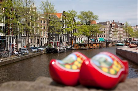 Souvenir clogs and canal, Amsterdam, Holland, Europe Stock Photo - Rights-Managed, Code: 841-06344836