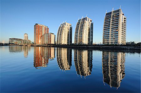 reflection of buildings in water - Modern apartments and MediaCity UK complex, Salford Quays, Manchester, Greater Manchester, England, United Kingdom, Europe Stock Photo - Rights-Managed, Code: 841-06345350