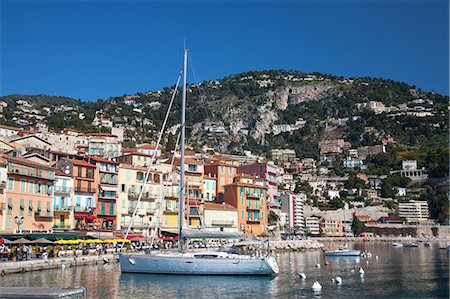 french riviera travel - Colourful buildings along waterfront, Villefranche, Alpes-Maritimes, Provence-Alpes-Cote d'Azur, French Riviera, France, Mediterranean, Europe Stock Photo - Rights-Managed, Code: 841-06341474