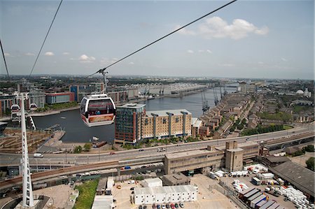 View from a cable car during the launch of the Emirates Air Line showing Excel Exhibition Centre in background, London, England, United Kingdom, Europe Foto de stock - Con derechos protegidos, Código: 841-06341514