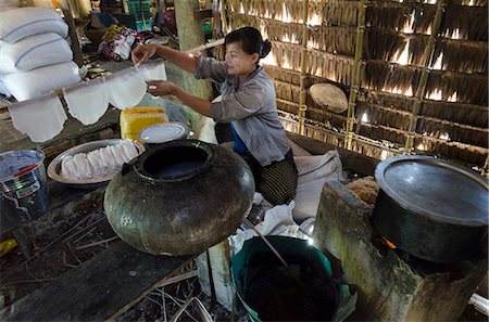 Young woman peparing rice noodles at home, Yae Saing Kone village, Irrawaddy Delta, Myanmar (Burma), Asia Stock Photo - Rights-Managed, Code: 841-06341792