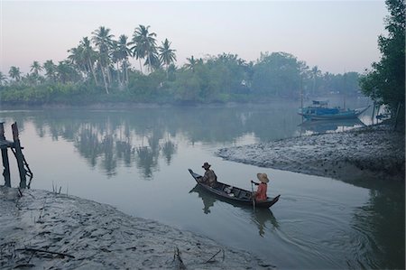 Two women on a small boat in early morning light, Oak Po Kwin Chaung village, Irrawaddy Delta, Myanmar (Burma), Asia Stock Photo - Rights-Managed, Code: 841-06341817