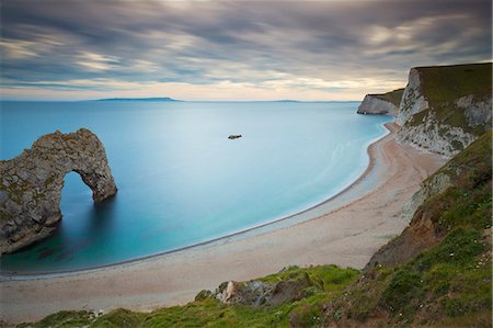 seascapes uk - Durdle Door, an eroded rock arch, and the wide sweeping beach, Jurassic Coast, UNESCO World Heritage Site, Dorset, England, United Kingdom, Europe Stock Photo - Rights-Managed, Code: 841-06342062