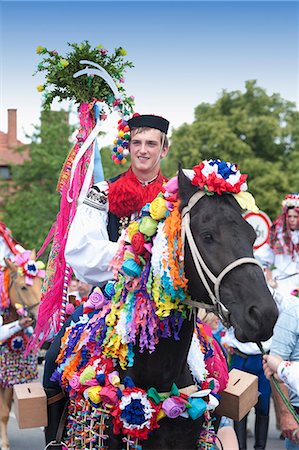 Man riding horse and wearing folk dress during festival Ride of the Kings, Vlcnov, Zlinsko, Czech Republic, Europe Stock Photo - Rights-Managed, Code: 841-06342115