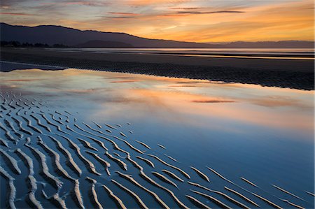 simsearch:841-06034385,k - Ondulations de sable sur la plage de Pohara au coucher du soleil, Golden Bay, île du Sud, Nouvelle-Zélande, Pacifique Photographie de stock - Rights-Managed, Code: 841-06343370