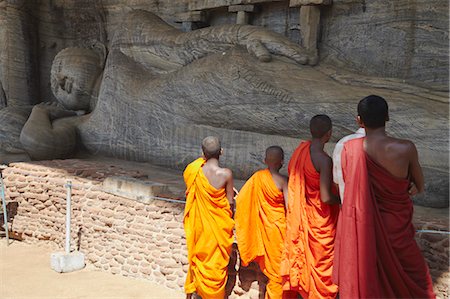 Monks looking at reclining Buddha statue, Gal Vihara, Polonnaruwa, UNESCO World Heritage Site, North Central Province, Sri Lanka, Asia Stock Photo - Rights-Managed, Code: 841-06343720