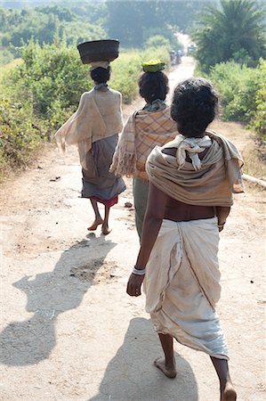 Dunguria Kondh tribeswomen walking barefoot to tribal market carrying baskets of produce on their heads, Bissam Cuttack, Orissa, India, Asia Stock Photo - Rights-Managed, Code: 841-06343916