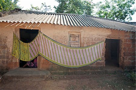 Cotton sari being hung out to dry across village house wall, rural Orissa, India, Asia Foto de stock - Con derechos protegidos, Código: 841-06343927