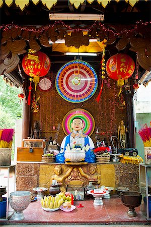 simsearch:841-06445056,k - Neon Buddhist display in a Buddhist temple in Phnom Penh, Cambodia, Indochina, Southeast Asia, Asia Stock Photo - Rights-Managed, Code: 841-06445027