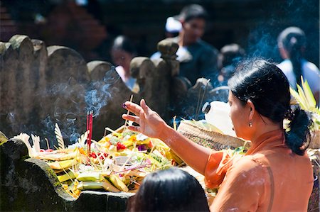 Balinese woman praying with incense at Pura Tirta Empul Hindu Temple, Bali, Indonesia, Southeast Asia, Asia Stock Photo - Rights-Managed, Code: 841-06445056