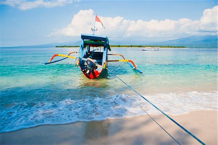 Gili Meno, einem traditionellen indonesischen Boot auf Gili Meno mit Gili Air und Lombok im Hintergrund, Gili-Inseln, Indonesien, Südostasien, Asien Stockbilder - Lizenzpflichtiges, Bildnummer: 841-06445073