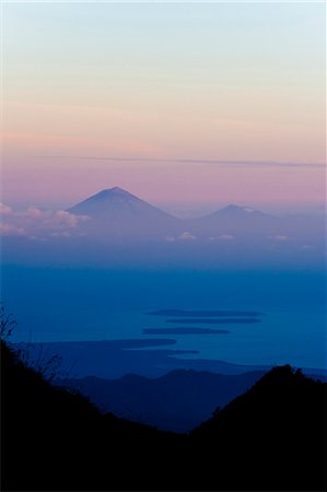 Sunset over Mount Agung and Mount Batur on Bali, and the Three Gili Isles taken from Mount Rinjani, Lombok, Indonesia, Southeast Asia, Asia Stock Photo - Rights-Managed, Code: 841-06445154