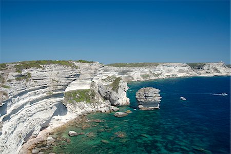 White limestone cliffs above emerald sea in Bonifacio, Corsica, France, Mediterranean, Europe Stock Photo - Rights-Managed, Code: 841-06445565