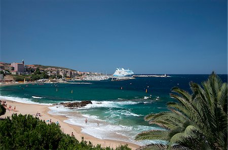 A view over the beach to the town of Propriano on the southwest coast of Corsica, France, Mediterranean, Europe Stock Photo - Rights-Managed, Code: 841-06445578