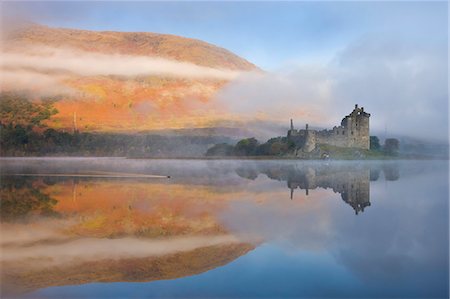 reflecting in water - A misty autumn morning beside Loch Awe with views to Kilchurn Castle, Argyll and Bute, Scotland, United Kingdom, Europe Stock Photo - Rights-Managed, Code: 841-06447496
