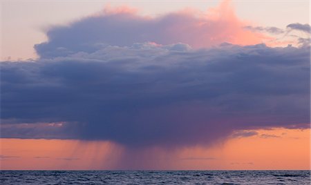 Heavy rainclouds at sunset over the English Channel, viewed from the Dorset Coast, Dorset, England, United Kingdom, Europe Foto de stock - Direito Controlado, Número: 841-06447530