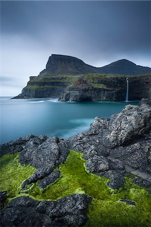 rock sky water - Dramatic coastline and waterfall at Gasadalur on the Island of Vagar, Faroe Islands, Denmark, Europe Stock Photo - Rights-Managed, Code: 841-06447564