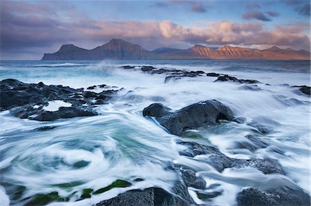denmark natural beauty faroe - Surging waves break over the rocky shores at Gjogv on the island of Eysturoy, Faroe Islands, Denmark, Europe Stock Photo - Rights-Managed, Code: 841-06447570