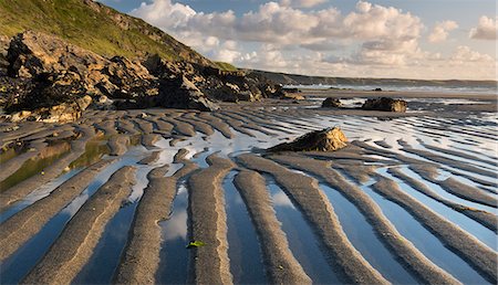 Patterns in the sand at low tide on Tregardock Beach, Cornwall, England, United Kingdom, Europe Foto de stock - Con derechos protegidos, Código: 841-06447601