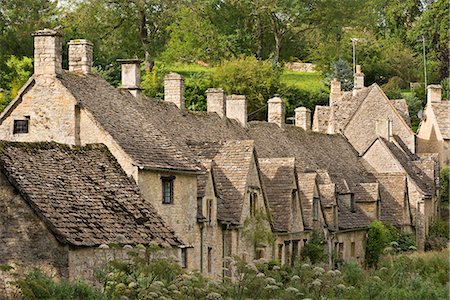 Picturesque cottages at Arlington Row in the Cotswolds village of Bibury, Gloucestershire, England, United Kingdom, Europe Foto de stock - Con derechos protegidos, Código: 841-06447616