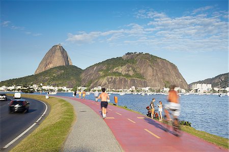 Personnes exerçant sur voie autour de la baie de Botafogo avec Sugar Loaf Mountain (Pao de Acucar) dans le fond, Rio de Janeiro, au Brésil, en Amérique du Sud Photographie de stock - Rights-Managed, Code: 841-06447645