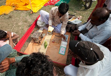 fortune teller (male) - Fortune telling green parakeet picking tarot cards at Sonepur Cattle Fair, Bihar, India, Asia Stock Photo - Rights-Managed, Code: 841-06447659