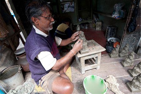 simsearch:841-06445627,k - Master sculptor making models from clay from the River Hugli, to be painted for festival ceremonies, Kumartuli district, Kolkata, West Bengal, India, Asia Stock Photo - Rights-Managed, Code: 841-06447738