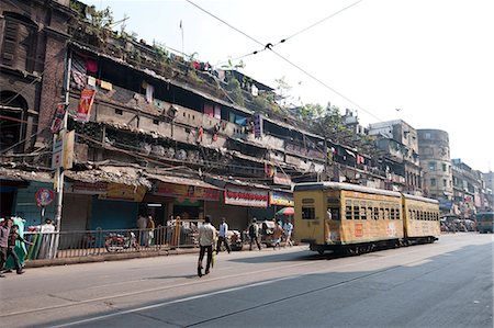 simsearch:841-05846861,k - Yellow Kolkata tram passing Kolkata slums in the early morning, Kolkata, West Bengal, India, Asia Stock Photo - Rights-Managed, Code: 841-06447762