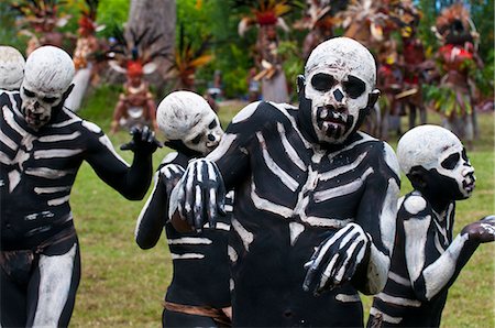 skeleton to human - Face and body painted local tribes celebrating the traditional Sing Sing in Paya, Papua New Guinea, Melanesia, Pacific Stock Photo - Rights-Managed, Code: 841-06448220