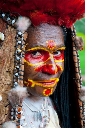 paya - Colourfully dressed and face painted local tribal woman celebrating the traditional Sing Sing in Paya, Papua New Guinea, Pacific Stock Photo - Rights-Managed, Code: 841-06448221