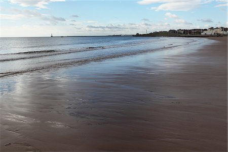Low tide at Seaburn Beach, Roker Pier is seen in the distance, Sunderland, Tyne and Wear, England, United Kingdom, Europe Stock Photo - Rights-Managed, Code: 841-06448440