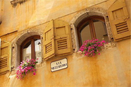 european street sign - Shuttered windows and flowers, Piazza Mercato, Belluno, Province of Belluno, Veneto, Italy, Europe Stock Photo - Rights-Managed, Code: 841-06449001
