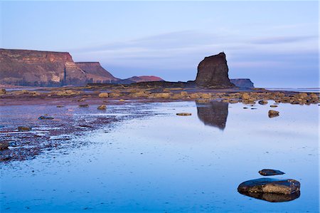 Early morning light on Black Nab and the cliffs of Saltwick Bay, North Yorkshire, Yorkshire, England, United Kingdom, Europe Stock Photo - Rights-Managed, Code: 841-06449615