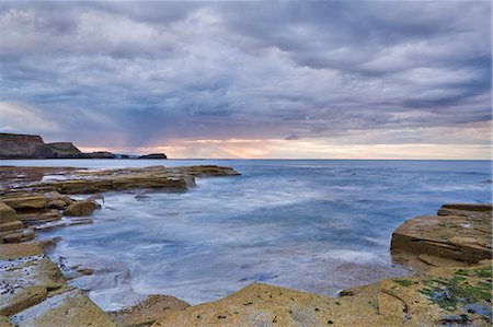 english ocean coast - A showery evening at low tide in Saltwick Bay, North Yorkshire, Yorkshire, England, United Kingdom, Europe Stock Photo - Rights-Managed, Code: 841-06449629