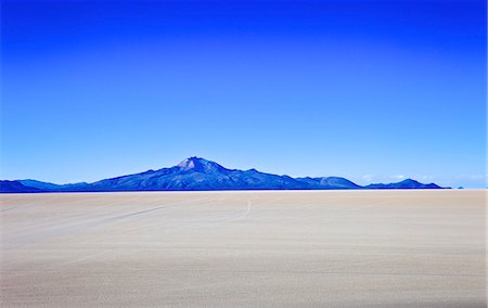 Salar de Uyuni salt flats and the Andes mountains in the distance, Bolivia, South America Stock Photo - Rights-Managed, Code: 841-06449715