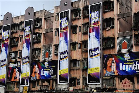 Advertisements on apartment buildings of Mumbai, Maharashtra, India, Asia Stock Photo - Rights-Managed, Code: 841-06499810