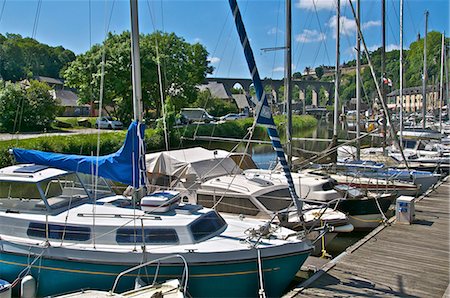 rance river - Sailboats moored on River Rance, with viaduct in the background, Dinan harbour, Brittany, France, Europe Stock Photo - Rights-Managed, Code: 841-06500010