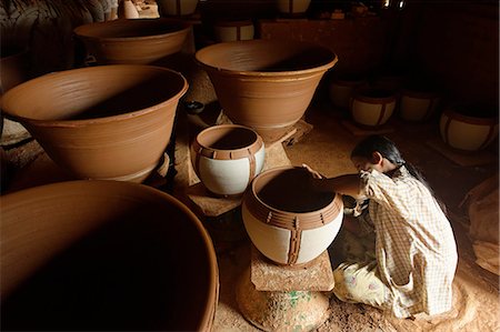 Potter in Nwe Nyein, a pottery town along the Irrawaddy river, Mandalay Division, Republic of the Union of Myanmar (Burma), Asia Stock Photo - Rights-Managed, Code: 841-06500209