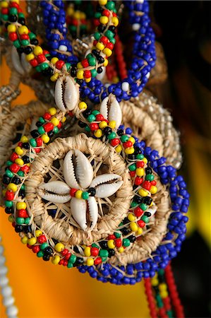 Candomble wear strings of beads made of seeds and shells in the colours of African gods. Cachoeira, Bahia, Brazil. Stock Photo - Rights-Managed, Code: 841-06500477