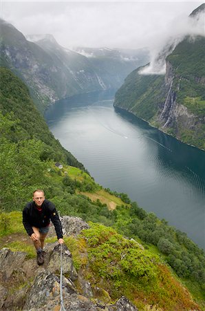 Hiking along Geirangerfjorden, near Skagefla, Geiranger, UNESCO World Heritage Site, More og Romsdal, Norway, Scandinavia, Europe Stock Photo - Rights-Managed, Code: 841-06500672