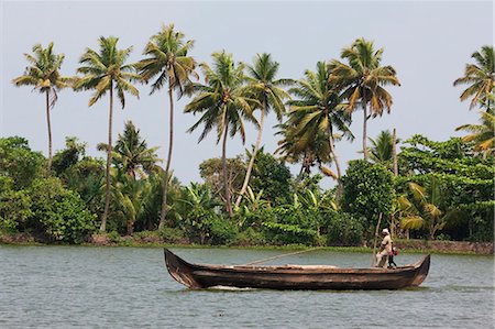 fishing boats in kerala - Fisherman in traditional boat on the Kerala Backwaters, Kerala, India, Asia Stock Photo - Rights-Managed, Code: 841-06501041