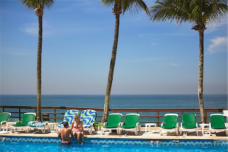 sheraton - Couple relaxing by pool at Sheraton Hotel, Rio de Janeiro, Brazil, South America Stockbilder - Lizenzpflichtiges, Bildnummer: 841-06501598