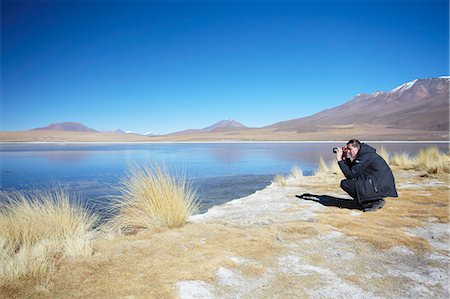 potosi - Man taking photos at Laguna Canapa on Altiplano, Potosi Department, Bolivia, South America Foto de stock - Con derechos protegidos, Código: 841-06501709