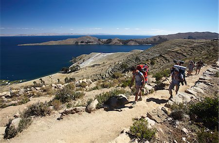 Backpackers hiking on Isla del Sol (Island of the Sun), Lake Titicaca, Bolivia, South America Photographie de stock - Rights-Managed, Code: 841-06501788