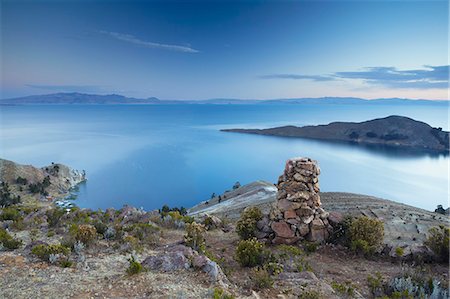 Stack of prayer stones on Isla del Sol (Island of the Sun) at sunset, Lake Titicaca, Bolivia, South America Photographie de stock - Rights-Managed, Code: 841-06501794