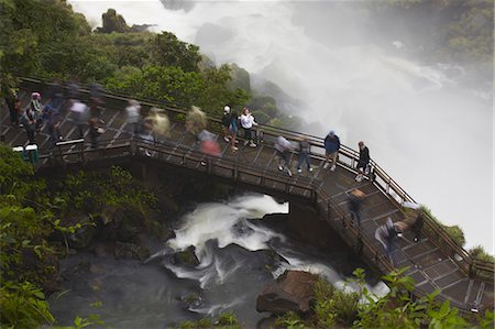 Tourists crossing bridge at foot of Bossetti Falls, Iguazu Falls, Iguazu National Park, UNESCO World Heritage Site, Misiones, Argentina, South America Photographie de stock - Rights-Managed, Code: 841-06501835