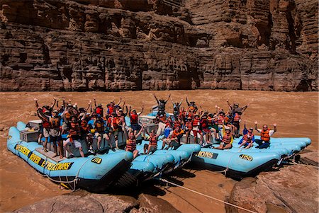 Happy tourists on two rafts celebrating, in the beautiful scenery of the Colorado River in the Grand Canyon, Arizona, United States of America, North America Stock Photo - Rights-Managed, Code: 841-06502480